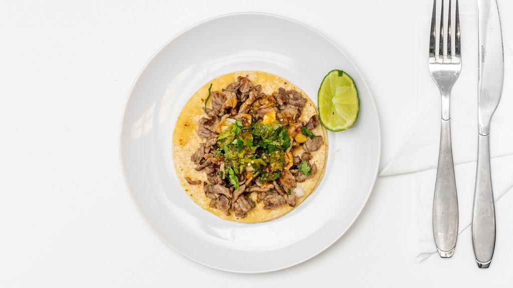Regular Taco · Choice of meat, onions, cilantro and salsa.