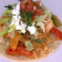 Camaron Ranchero Taco · Sautee Shrimp, tomato sauce, bell peppers &  onions, Served over Corn Tortilla rice, sour cr...