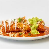 Burrito Mojado · Choice of meat, rice, beans. Topped with red sauce, melted cheese, sour cream, guacamole jal...