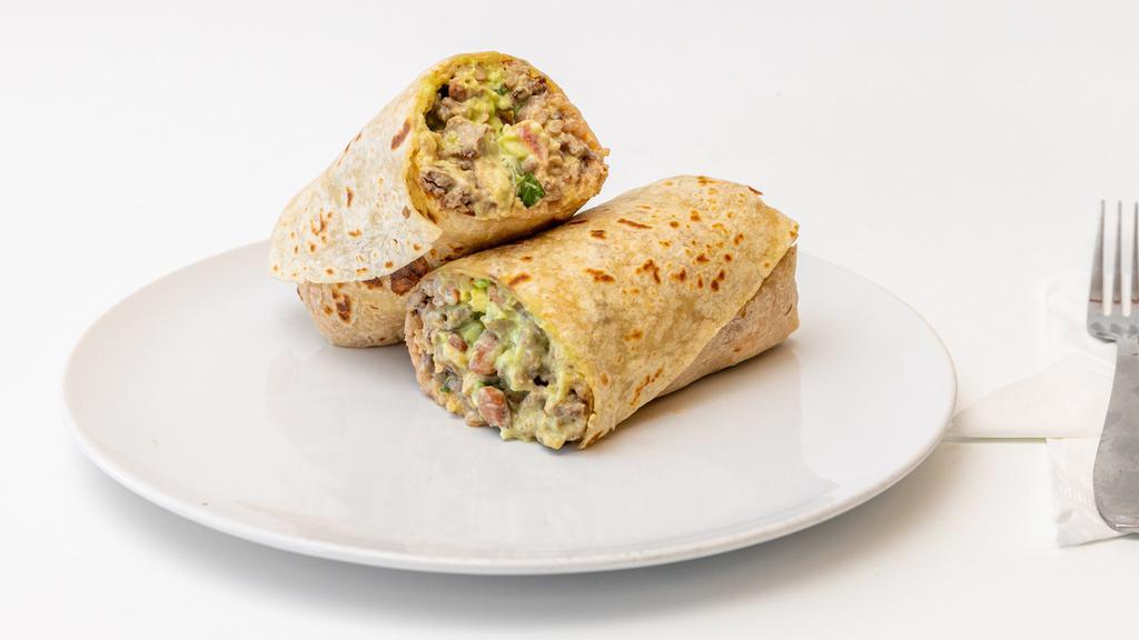 Vegetable Burrito · Rice, beans, onions, bell peppers, jalapenos, broccoli, mushroom.zucchini, cilantro and tomatoes.