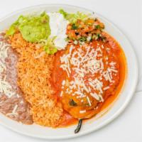 Chile Relleno Plate · One Poblano pepper stuffed with cheese cover on red sauce served with rice, beans, cheese, g...