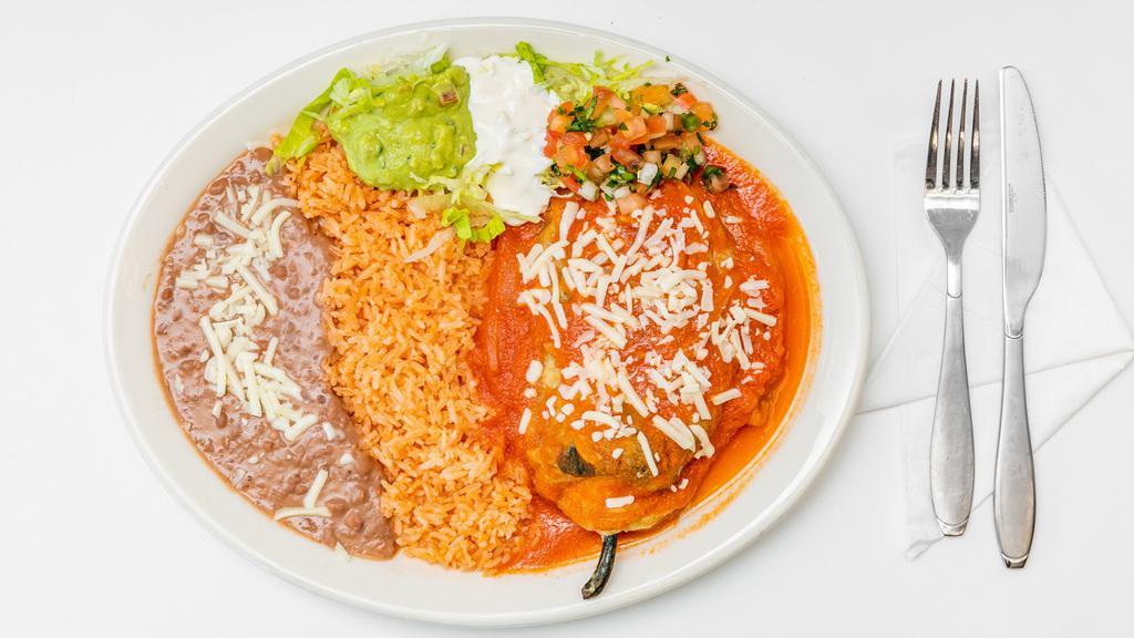 Chile Relleno Plate · One Poblano pepper stuffed with cheese cover on red sauce served with rice, beans, cheese, guacamole sour cream & Pico de Gallo. Com tortillas included.