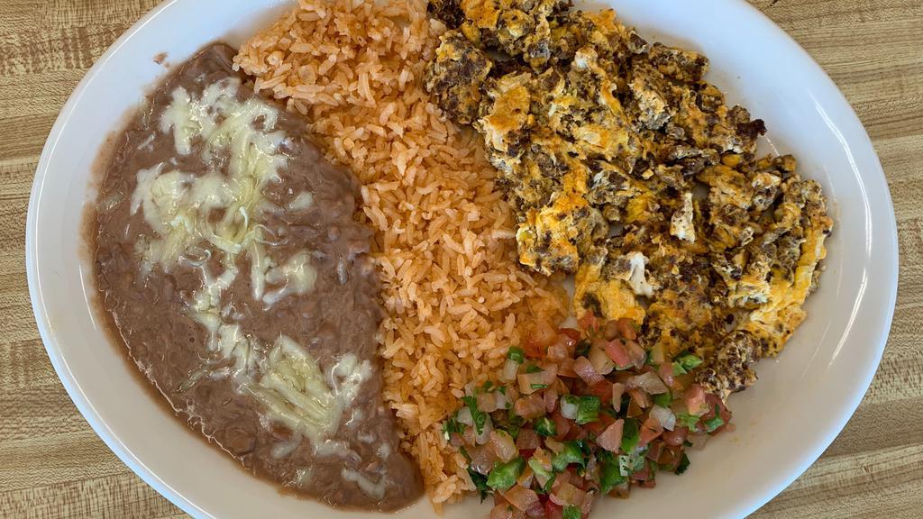 Huevos Con Chorizo Plate · Scrambled eggs mixed with chorizo, served with rice, beans, cheese, onions, cilantro and tomatoes.Corn tortillas included.