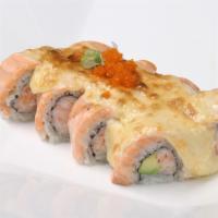 Lion King Roll · California roll topped with a choice of baked salmon or scallop with tobiko and eel sauce.