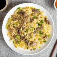 Rice to Meet You - Beef Fried Rice 牛炒飯 · Juicy beef and veggies stir fried and cooked with rice in traditional Chinese spices.