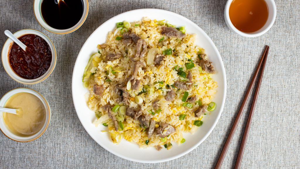 Rice to Meet You - Beef Fried Rice 牛炒飯 · Juicy beef and veggies stir fried and cooked with rice in traditional Chinese spices.