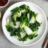 Bok Choy the World 蒜炒小白菜 · Spinach and Chinese bok choy stir-fried in a garlic sauce. Garnished with spring onions.