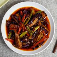 Spicy Eggplant 魚香茄子 · Eggplant, peppers, onions, and tomatoes cooked in a hot and spicy sauce.