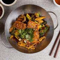 Spicy Tofu 干鍋豆腐 · Spicy tofu cooked in a hot sauce and garnished with spring onions and jalapenos.