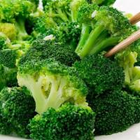 Stir Fried Brocco Lee 炒西蘭花 · Fresh broccoli stir fried in a spicy garlic sauce. Garnished with spring onions.