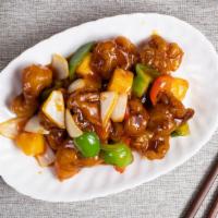 Sweet & Sour Pork 古老肉 · Beef and pork cooked in a mix of sweet and sour flavoring with veggies.