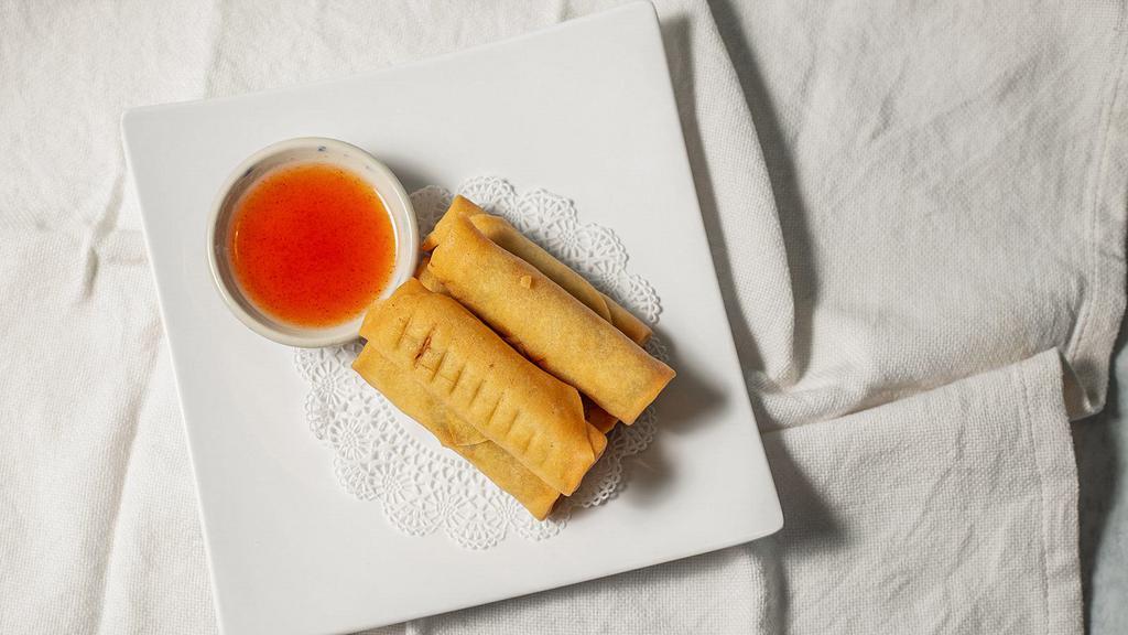 2. Egg Rolls · Deep-fried egg rolls stuffed with chicken, silver noodle, and vegetables, serve with sweet and sour sauce.