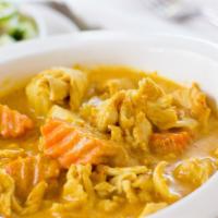Yellow Curry · Spicy. Spicy curry mixed with cucumbers, onions, carrots, potatoes and peppers. Medium spice...