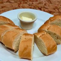 Sliced French bread and butter per order · Sliced French bread and butter per order