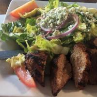 Steak Salad · Marinated bistro filet on chopped romaine tossed in a balsamic vinaigrette with artichoke he...