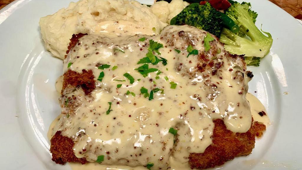 Panko Crusted Chicken Breast · Boneless skinless breast coated in Japanese bread crumbs topped with honey mustard sauce served with choice of roasted garlic mashed potatoes, sautéed vegetables.
