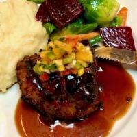 Grilled Bistro Filet · Topped with demi-glace, spicy papaya-jicama salsa served with mashed potatoes, sautéed veget...