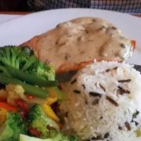 Chicken Marsala · Grilled chicken topped with a creamy marsala wine sauce served with rice, sautéed vegetables.