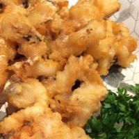 Crispy Calamari · Deep fried light batter calamari; served with sweet and sour sauce