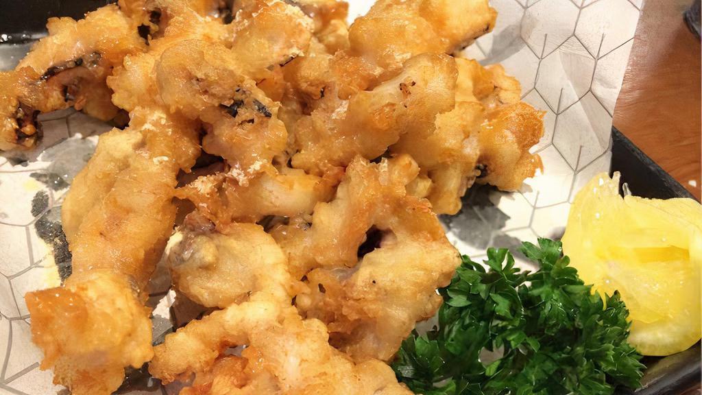 Crispy Calamari · Deep fried light batter calamari; served with sweet and sour sauce