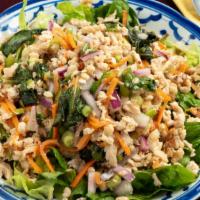 Chicken Salad (Larb Gai) · Minced chicken mixed with onion, and carrot in lime juice dressing.