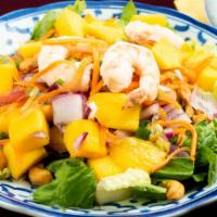 Mango Salad · Fresh mango, prawns, onion , cashew nuts and carrot in lime juice dressing.