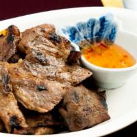 Barbecued Pork · Thai style barbecued pork marinated with Thai herbs, served w/sweet & sour sauce.