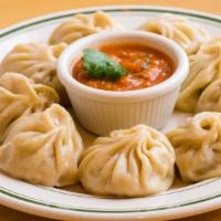2. Vegetable Momo (8 Pcs) · Steamed dumpling filled with minced cabbage, cauliflower, spinach, cheese, onion, cilantro, ...
