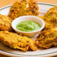 Vegetable Pakora · Freshly marinated vegetables in a chickpeas batter and deep fried in oil.