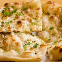 Naan · Most famous of Indian breads baked then brushed with fresh ghee.