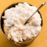 71. Kheer · Basmati rice cooked in a milk with special herbs and spices nut and raisins.