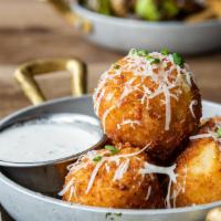 Mac & Cheese Balls · Beer cheese sauce, fresno chiles, chives, and parmesan.