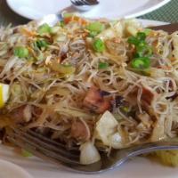 Pancit Sisig · Thin rice noodles cooked with banana blossoms.