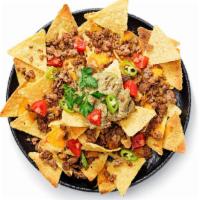 Mas Nachos with Carnitas · Hot & Crisp Mexican-style chips topped with perfectly seasoned shredded pork, and a generous...