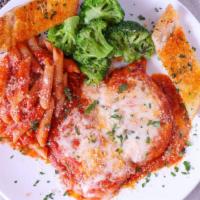 Chicken Parmigiana · Chicken Breast Sautéed with Tomato Sauce, Parmigiano & Mozzarella Cheese.