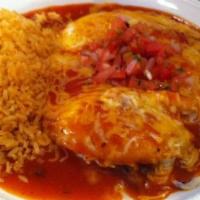Ranchera · Shredded chicken enchilada topped with ranchera sauce.  Served with refried beans and rice.
...