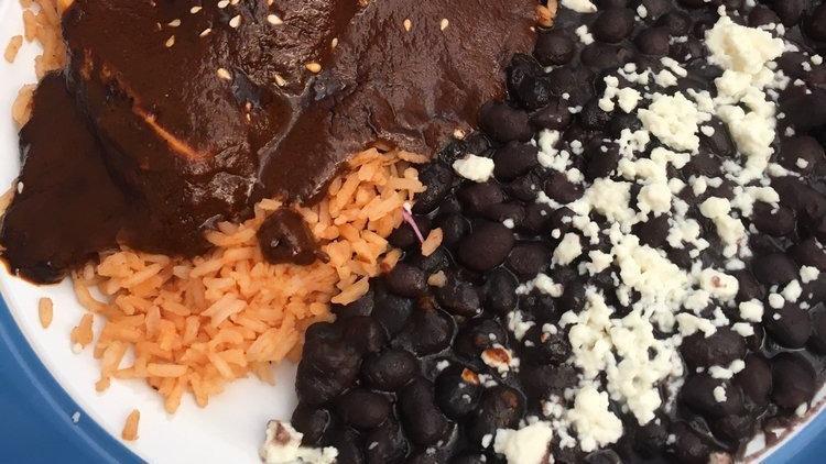 Mole Enchilada · Home made mole sauce with shredded chicken.
Served with refried beans and rice.