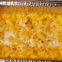 Mac & Cheese · Homemade mac and cheese with cheddar and mozzarella cheese baked to perfection.