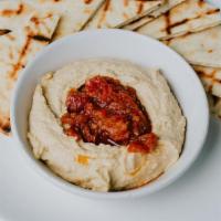 Hummus · House-made hummus served with Grilled Pita