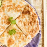 Chinese Onion Pancakes · Tasty pan-fried flatbread folded with oil and minced green onions.