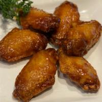 Spicy Honey Garlic Chicken Wings · Sweet and spicy honey fried chicken wings