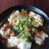 Pork Wontons in Spicy Chili Sauce · Six pieces.