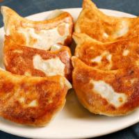 Pot Stickers (6 Pieces) · Hand rolled Chinese pastry stuffed with a ginger-infused mixture of ground pork and napa cab...