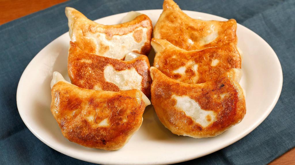 Pot Stickers (6 Pieces) · Hand rolled Chinese pastry stuffed with a ginger-infused mixture of ground pork and napa cabbage lightly pan-fried to a golden brown.