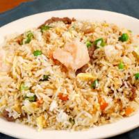 Combination Fried Rice · Jasmine white rice wok-fried with a combination of chicken, beef, and shrimp, fluffed eggs, ...