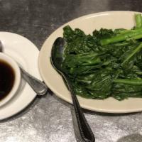 Gai Lan · Fresh Chinese broccoli blanched and sprinkled with sesame oil. Served with oyster sauce on t...