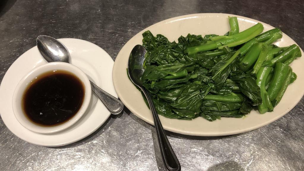 Gai Lan · Fresh Chinese broccoli blanched and sprinkled with sesame oil. Served with oyster sauce on the side.
