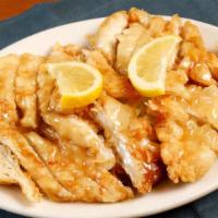Lemon Chicken · Golden fried sliced chicken breast with Xiao Loong's sweet and tangy ginger lemon sauce topp...