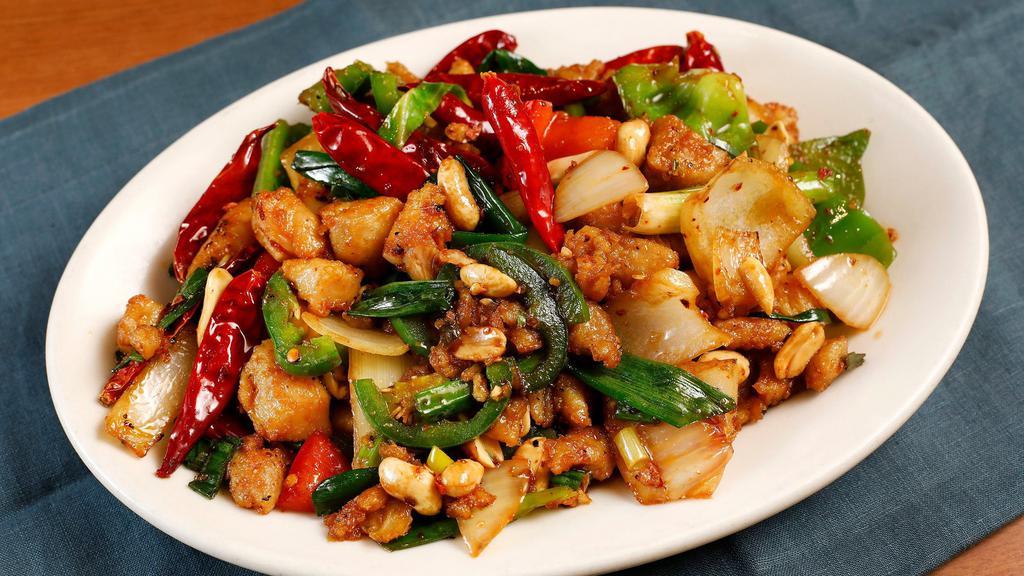 Hunan Peanut Chicken · Tender seasoned diced chicken and roasted peanuts dry sauteed with roasted red hot chili, garlic, diced green hot peppers, minced bell peppers, and onions.