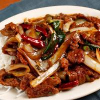 Mongolian Beef · Spicy. Tender sliced beef sauteed with green onions, julienned yellow onions, and roasted re...